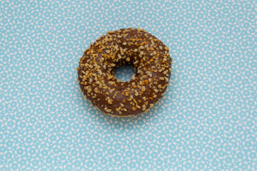 donut on blue with pattern background, top view