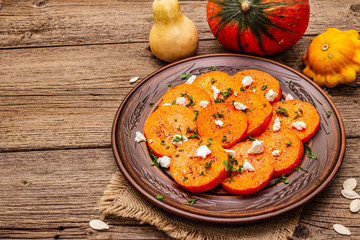 Roasted pumpkin with salted cheese and herbs