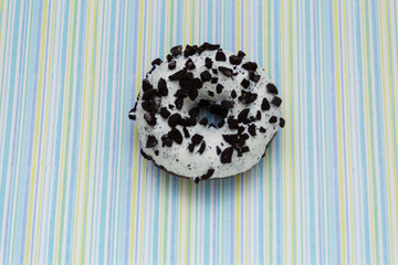 donut on colored lines background, top view