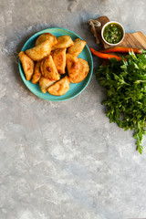 Empanadas de carne argentinas con  chimichurri salsa