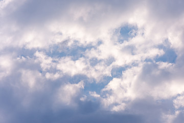 landscape sky with blue clouds and sunbeams at sunset. Background texture