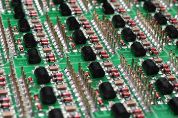 Close-up side view of a PCB board with SMD components
