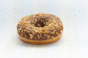 donut on gray with pattern background, close up view