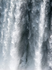 Iguazu Falls. A waterfall is an area where water flows over a vertical drop or a series of steep...