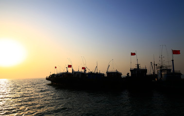 The fishing boats docked at the sea