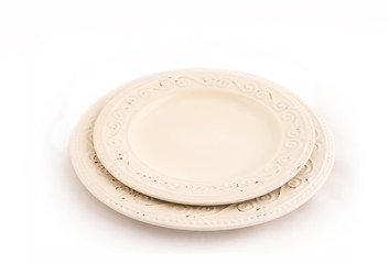 Two stained plates with ornaments and scuffs on a white isolate.