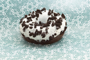 Obraz na płótnie Canvas donut on gray with pattern background, close up view