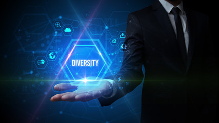 Man hand holding DIVERSITY inscription, social media concept