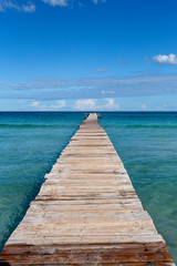 Fototapeta premium A wooden pier at Playa de Muro beach in Mallorca