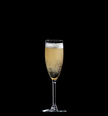 full champagne glass on black background