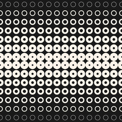 Fototapeta na wymiar Halftone circles and rings. Monochrome geometric seamless pattern