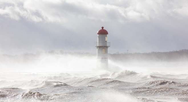 Lachine lighthouse being battered by a storm in early November, Quebec, Canada. © Hummingbird Art