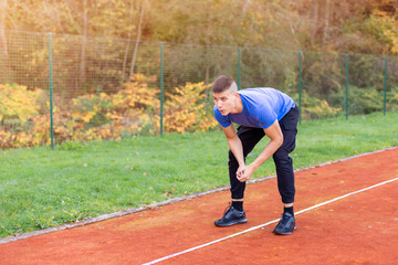 Obraz premium Young man jogging in the morning outdoor on the running race track