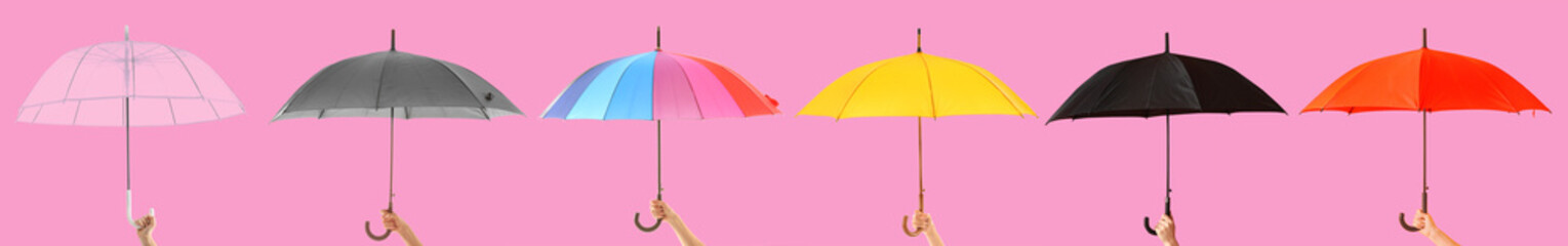 Female hand with stylish umbrella on color background