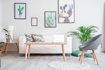 Stylish interior of living room with sofa