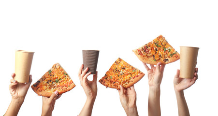 Female hands with paper cups and pizza on white background