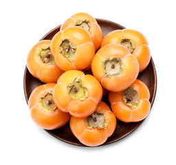 Naklejka na ściany i meble Plate with ripe persimmons isolated on white