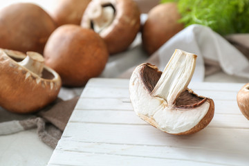 Fresh champignon mushrooms on table