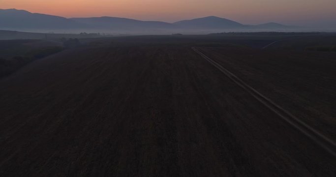 Aerial drone fly over northern Hungarian landscape at sunrise. Northern Matra mountains and hills.