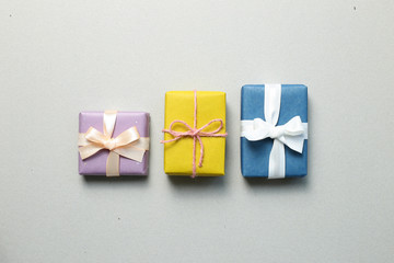 Gift boxes on gray background. Christmas or birthday concept