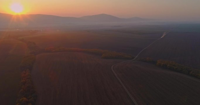 Aerial drone fly over northern Hungarian landscape at sunrise. Northern Matra mountains and hills.