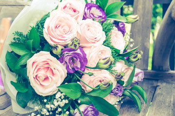 Close up of Violet and pink rose flower bouquet.