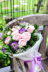 Close up of Violet and pink rose flower bouquet.