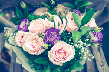 Close up of Violet and pink rose flower bouquet.