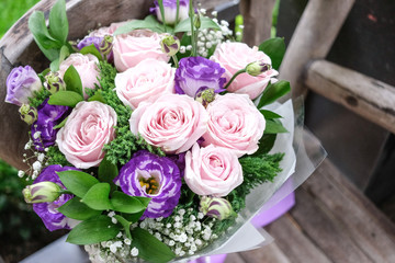 Close up of Violet and pink rose flower bouquet.