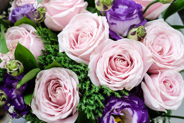 Close up of Violet and pink rose flower bouquet.