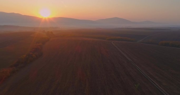 Aerial drone fly over northern Hungarian landscape at sunrise. Northern Matra mountains and hills.