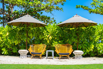 Umbrella and chair on the beach and sea with blue sky