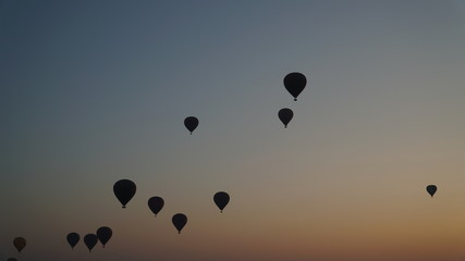 Many hot air balloons above Bagan in Myanmar with sunrise time.