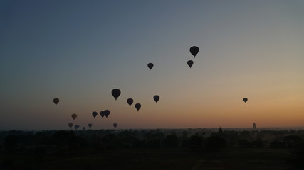 Many hot air balloons above Bagan in Myanmar with sunrise time.