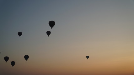 Many hot air balloons above Bagan in Myanmar with sunrise time.