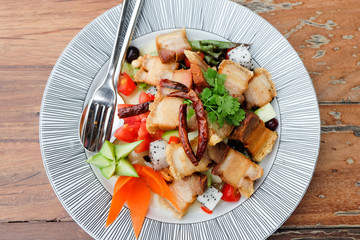 Fruit salad with crispy pork