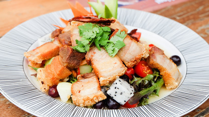 Fruit salad with crispy pork
