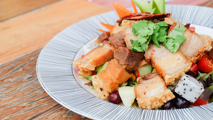Fruit salad with crispy pork