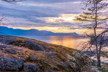 View of ocean sunset over mountains in beautiful British Columbia.