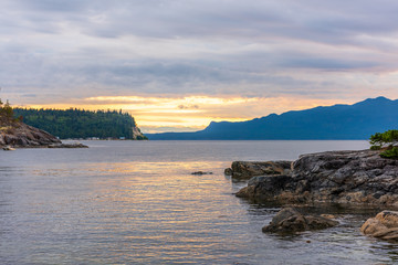 View of ocean sunset over mountains in beautiful British Columbia.