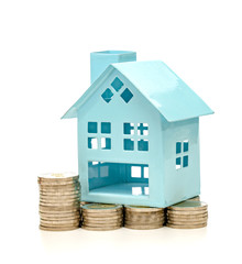coins stacks and house on white background,business saving and investment concept
