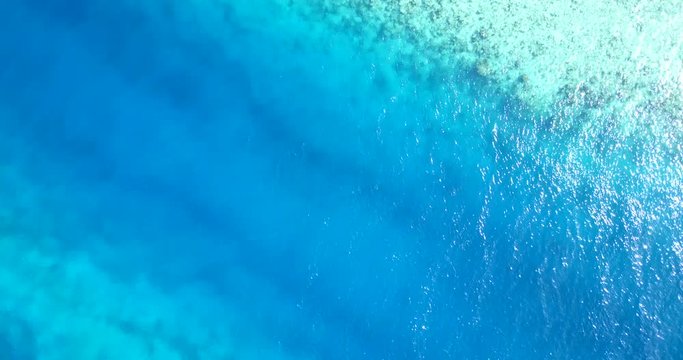 serene waters with rocky coral reefs in bahamas island