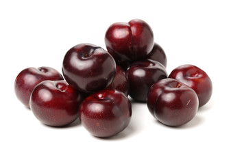 Plums on white background