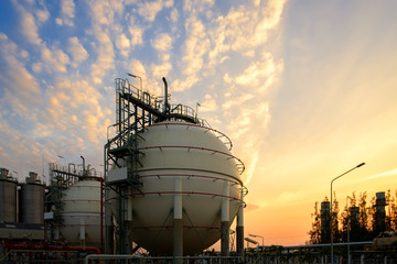 Gas storage sphere tanks and pipeline in petrochemical industrial plant on sky sunset background, Manufacturing of petroleum industry plant