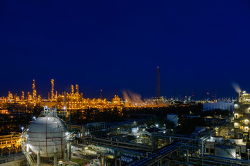 Fototapeta na wymiar Petroleum industrial plant at twilight time, Manufacturing of petrochemical industrial, Oil and gas refinery