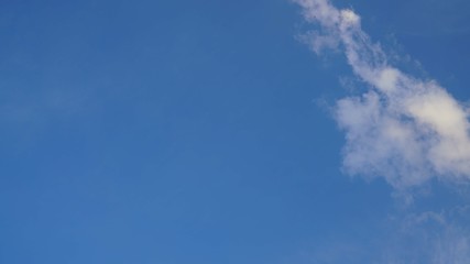 White cloud and blue sky background with copy space