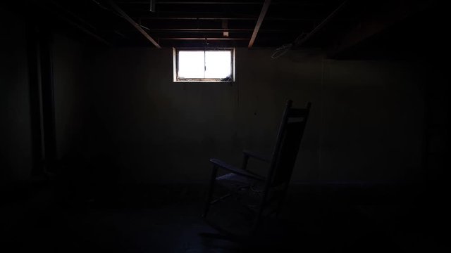 Creepy Rocking Chair in Dirty Basement