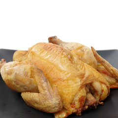 Whole roasted chicken against white background