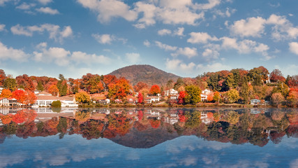 Fall Landscape showing Lake houses with reflections in Lake Junaluska