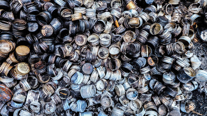 Garbage from old metal bottle caps.reuse concept.